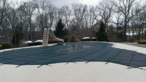 in-ground pool with safety pool cover