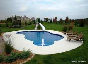 Free-form in-ground pool with slide and fountain